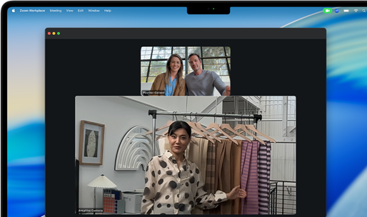 A video call on a MacBook Pro where a woman shows fabrics to two people on the call, with Center Stage keeping her centered in the frame as she moves around