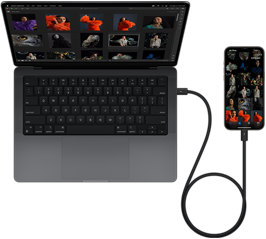 iPhone&nbsp;15&nbsp;Pro&nbsp;Max متصل بجهاز MacBook&nbsp;Pro مقاس 14&nbsp;إنش بواسطة USB-C‏