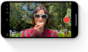 A frame of an Action mode clip showing a person running up a set of stairs.